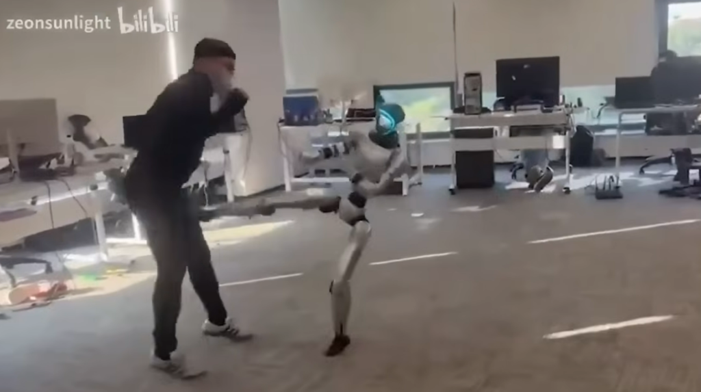Robot kicking man where it hurts the most